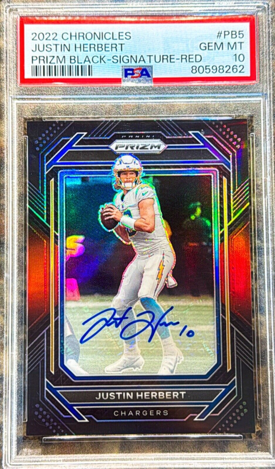 Justin Herbert 2022 Panini Chronicles Prizm Black Signature Red /99 Auto PSA 10