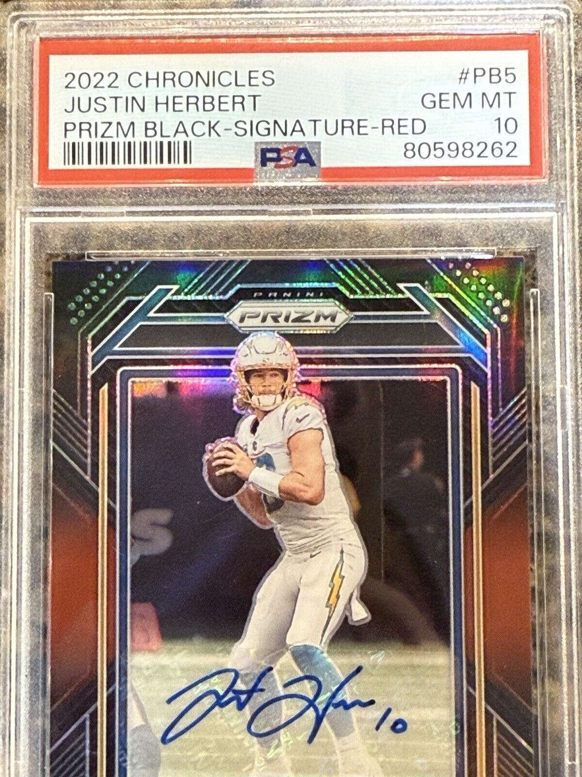 Justin Herbert 2022 Panini Chronicles Prizm Black Signature Red /99 Auto PSA 10