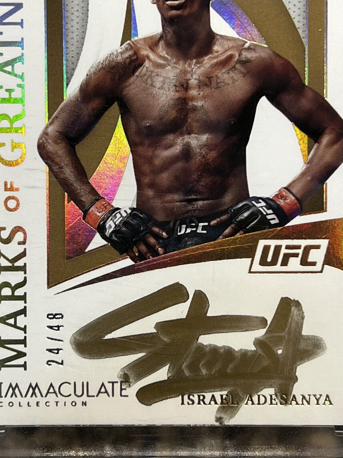 Israel Adesanya 2021 Panini Immaculate UFC Marks Greatness 24/48 Gold Autograph